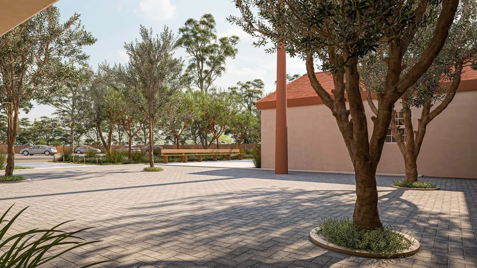 Rendering of a shaded paved plaza with olive trees in round planters, a long wooden bench and a terracotta column beside a stucco building, with parking beyond.