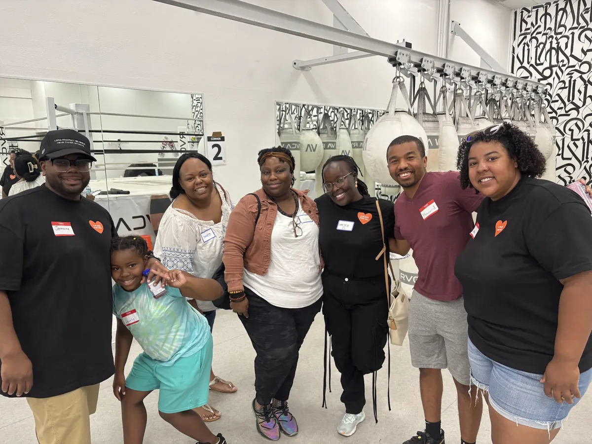 Friends smile together for a group photo at a church launch celebration.